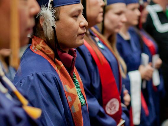 A graduating student in cap and gown.